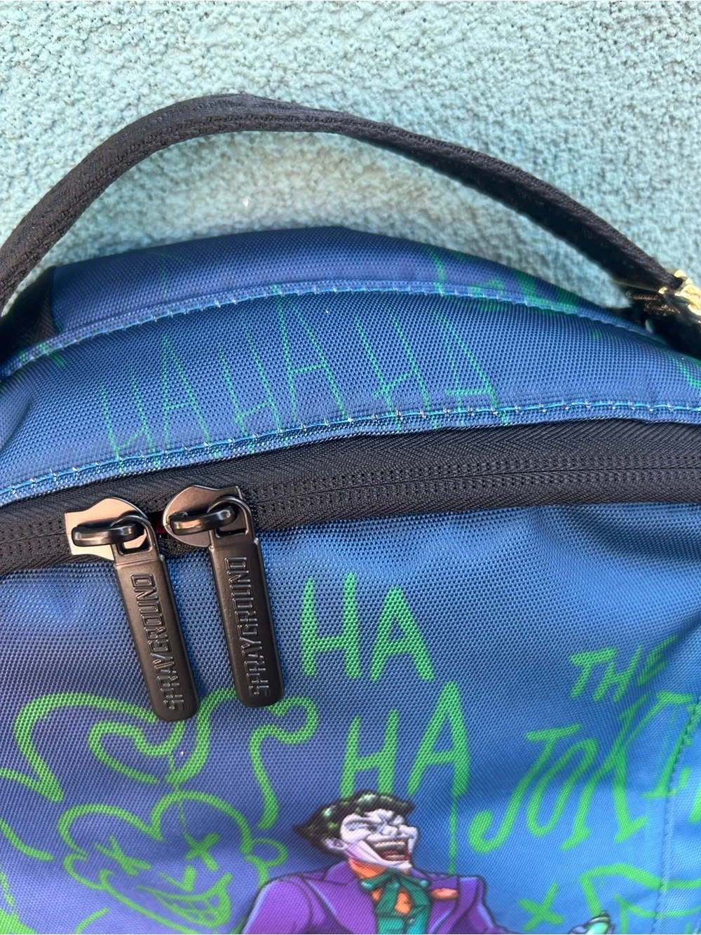 Sprayground Joker Blue Green Graphic Backpack